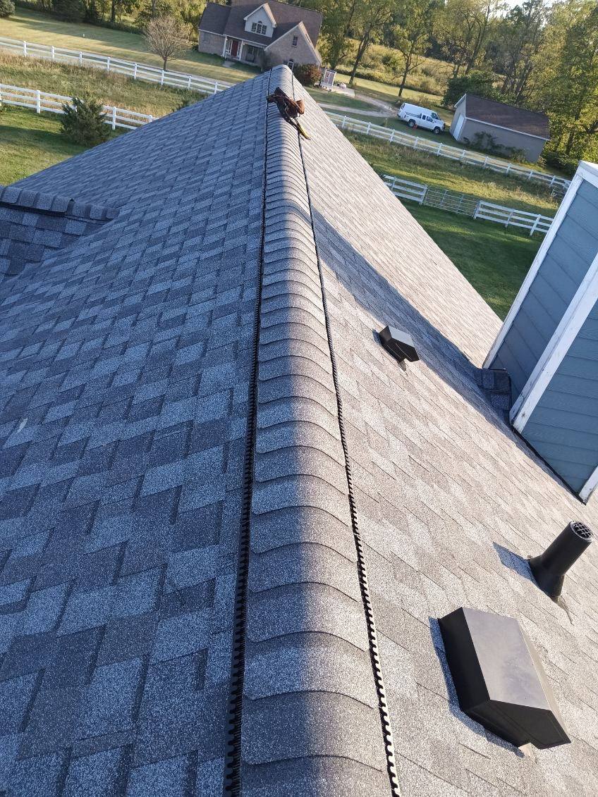 Aerial view of completed ridge cap on Michigan roof replacement